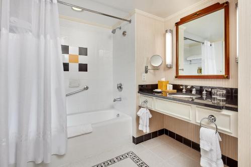 
a bathroom with a sink, toilet and bathtub at Orchard Hotel in San Francisco
