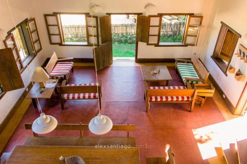 an overhead view of a living room with chairs and tables at Casa do Canto in Abraão