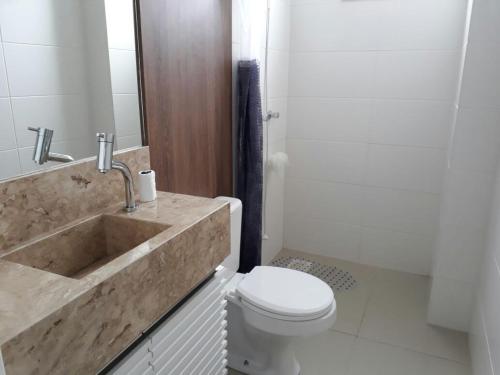 a bathroom with a tub and a toilet and a sink at Sonatta in Torres