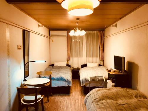 Un pat sau paturi într-o cameră la Daigo House
