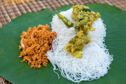 a plate of food with rice and vegetables on it at La Pentera in Hambegamuwa