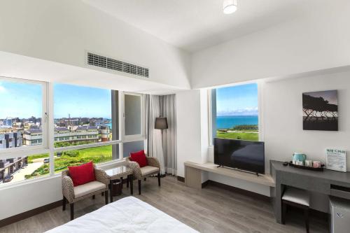 Postel nebo postele na pokoji v ubytování Tien Hsiang Lin Sea Dragon King Hotel