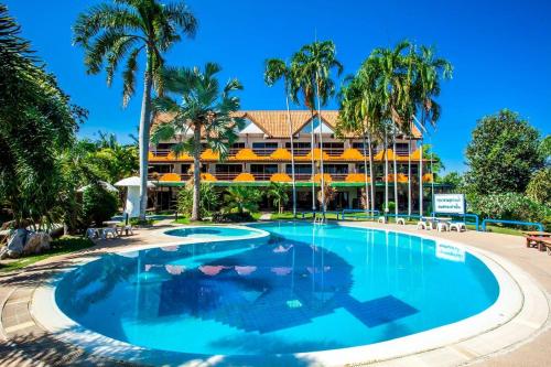 a large swimming pool in front of a resort at Duenshine Resort in Kanchanaburi