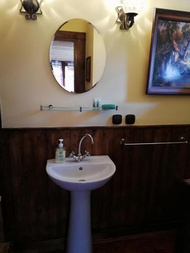 a bathroom with a sink and a mirror at Ranch pod lesom Slovensky Raj in Spišský Štiavnik