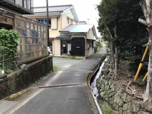 an empty street in front of a house at Guest House Itokawa in Matsuzaki