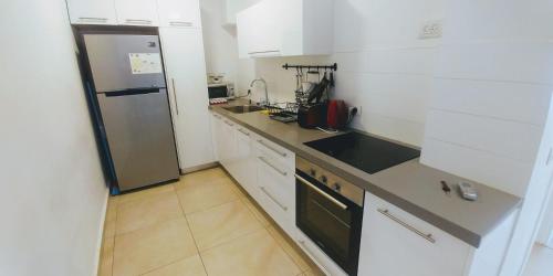 Una cocina o zona de cocina en Begin19 Apartments & Hostel
