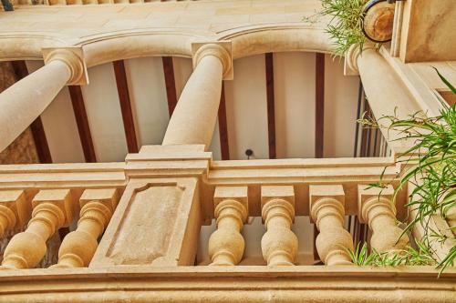 a close up of a building with columns at Cas Comte Suites & Spa - Adults Only in Lloseta