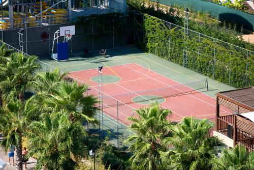 an overhead view of a tennis court with palm trees at Adalya Elite Lara Hotel - Ultra All Inclusive in Lara
