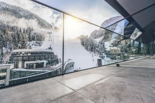 a view of a cruise ship through a window at Elizabeth Arthotel Adults Only in Ischgl