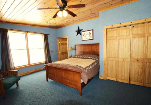 a bedroom with a bed and a ceiling fan at Float Ranch in Five Points