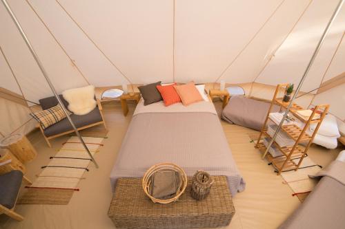 a room with two beds and chairs in a dome tent at GoOutside Venezia in Cavallino-Treporti