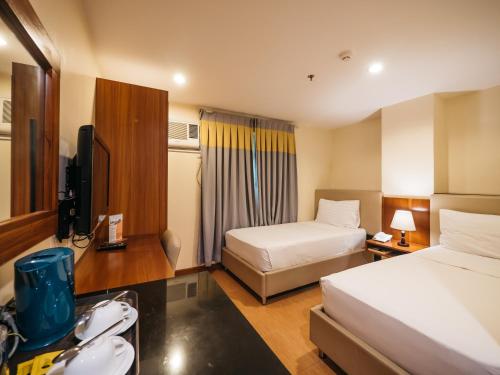 Ένα ή περισσότερα κρεβάτια σε δωμάτιο στο The Well Hotel