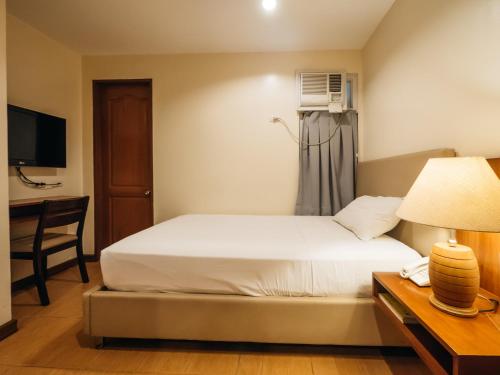 Ένα ή περισσότερα κρεβάτια σε δωμάτιο στο The Well Hotel