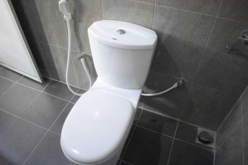 a bathroom with a white toilet in a room at Lakeside Villa in Anuradhapura