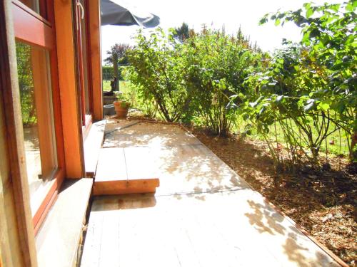 an open door of a house with a porch at Holiday home Brokantie in Pamel