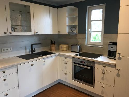 Kuchyň nebo kuchyňský kout v ubytování Ferienwohnung Lilly