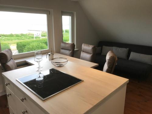 a living room with a table with wine glasses on it at Ferienwohnung Fritzi in Glowe