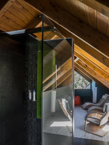 a glass wall in a room with a bunk bed at Casa Gomez in Santa Cilia de Jaca