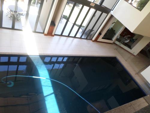 an overhead view of a swimming pool in a house at The Links Guest House in Pretoria