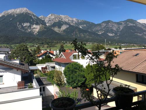 a view of a city with mountains in the background at Citybergblick in Innsbruck