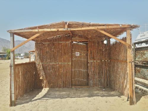 a wooden building in the middle of the desert at Sina Star Camp in Nuweiba