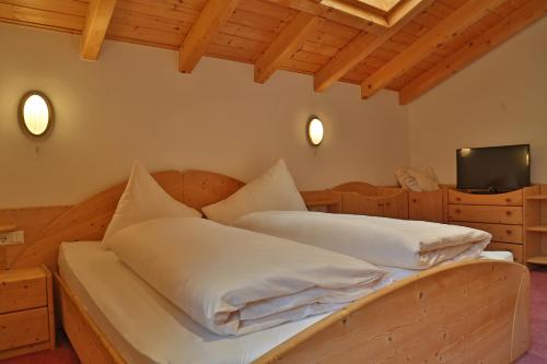 Cama o camas de una habitación en Alp Larain B&B