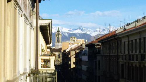 a view of a city with mountains in the background at Alma Clara B&B in Turin