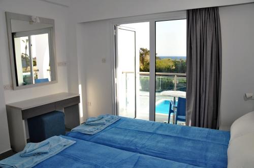 Ένα ή περισσότερα κρεβάτια σε δωμάτιο στο Kaos Hotel Apartments