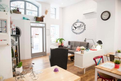 a living room with a couch and a table at Hotel Smile & Co Hostal Boutique in Alicante