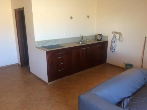 a kitchen with a sink and a couch in a room at Casa Boteto 2 Bedroom Ground Floor Apartment in Sal Rei