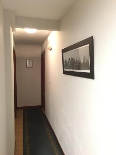 a wall with a picture of a man on it at Hostal Hilton in Burgos