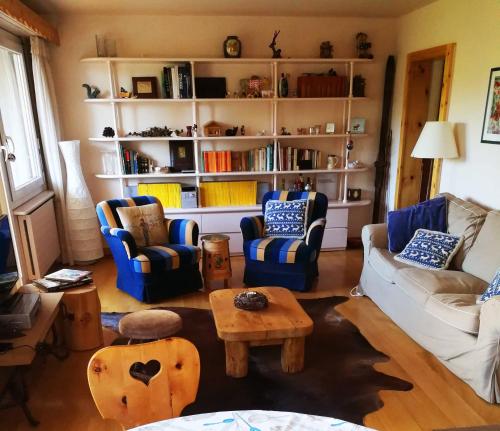 a living room with couches and chairs and a table at Apartment in Crans Montana Town Centre Mountain View in Crans-Montana