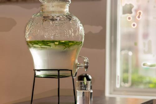 a glass jar filled with liquid sitting on a table at Pearl Royal Hotel, Colombo in Colombo