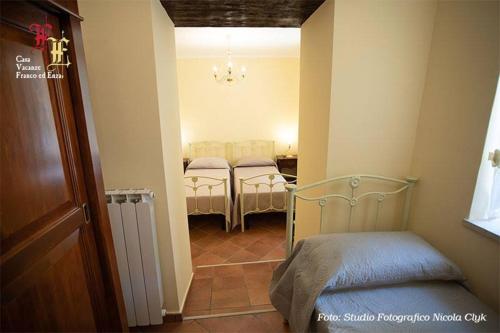 Кровать или кровати в номере Casa Vacanze - Franco ed Enza