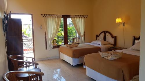 Кровать или кровати в номере Hotel My Lovina