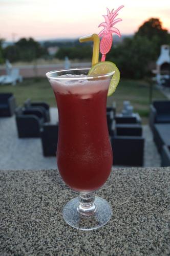 a drink in a glass sitting on a table at Villa Natalija in Medulin