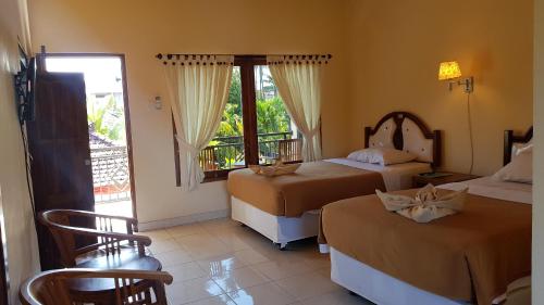 Кровать или кровати в номере Hotel My Lovina