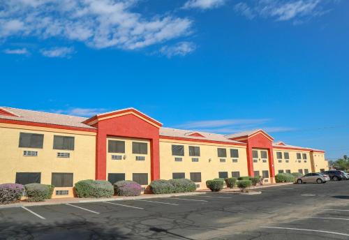 an empty parking lot in front of a building at Budget Inn Phoenix in Phoenix