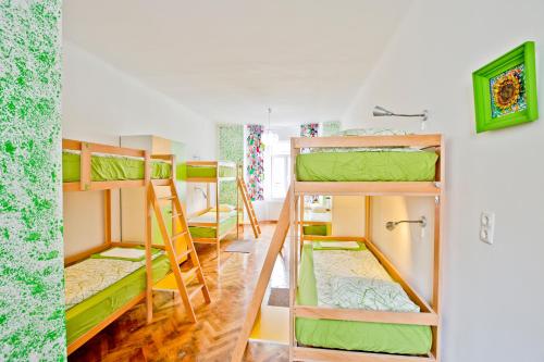 a group of bunk beds in a room at Centrum House Hostel in Braşov