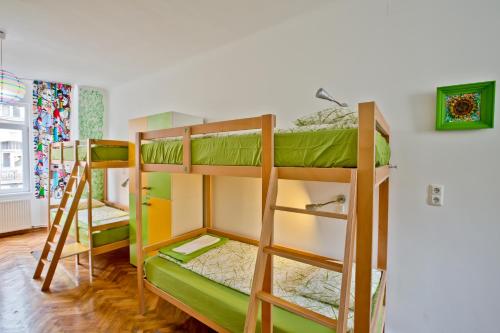 a bunk bed room with two bunk beds at Centrum House Hostel in Braşov