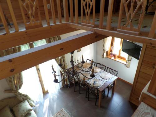 an overhead view of a dining room with a table and chairs at Siedlisko Gruszki Puszcza Białowieska in Narewka