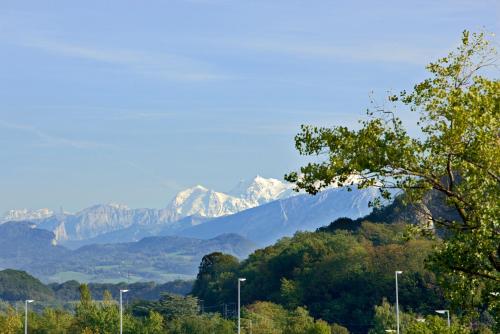a view of a mountain range with snow capped mountains at Mercure Annemasse Porte De Genève in Gaillard
