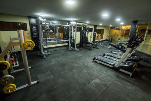 a gym with several treadmills and machines at Garbos Trade Hotel in Mossoró