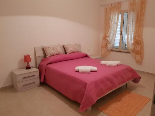 Un pat sau paturi într-o cameră la La Cantoniera