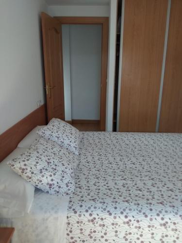 A bed or beds in a room at Apartamentos Vive Soria
