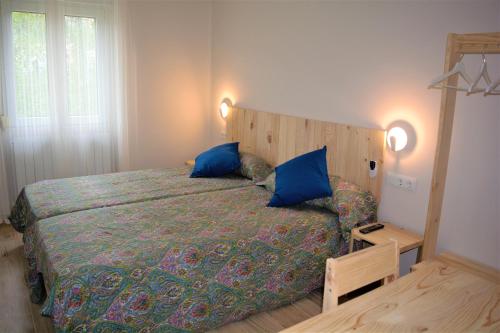 Postel nebo postele na pokoji v ubytování B&B LOS LLANOS