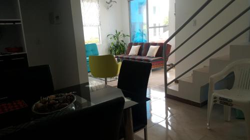 a living room with a couch and a chair at Condominio Santa Hagia Sofia - Casa y 2 apartamentos in Flandes