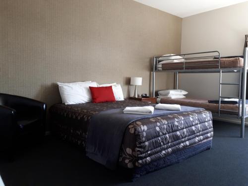 Postel nebo postele na pokoji v ubytování Northpark Motel