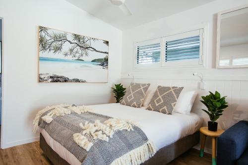a bedroom with a bed and a window at BIG4 Sandstone Point Holiday Resort Bribie Island in Bongaree