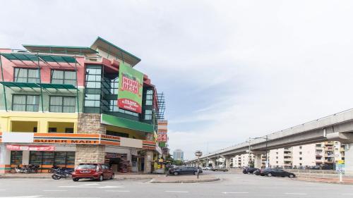 a building on a street with cars parked on the street at Hotel Sunjoy9 Bandar Sunway in Petaling Jaya
